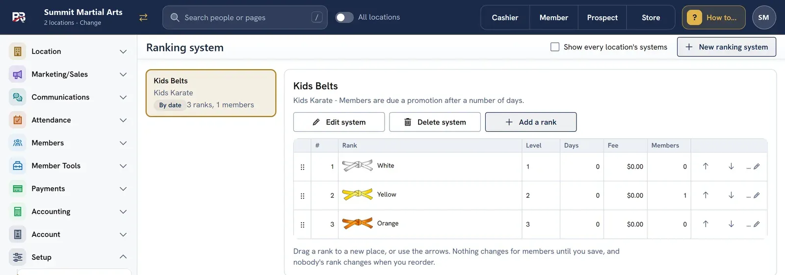 The Ranking system screen: a Kids Belts system for Kids Karate with White, Yellow and Orange ranks, each with a belt picture, level, days and fee, and arrows to reorder.