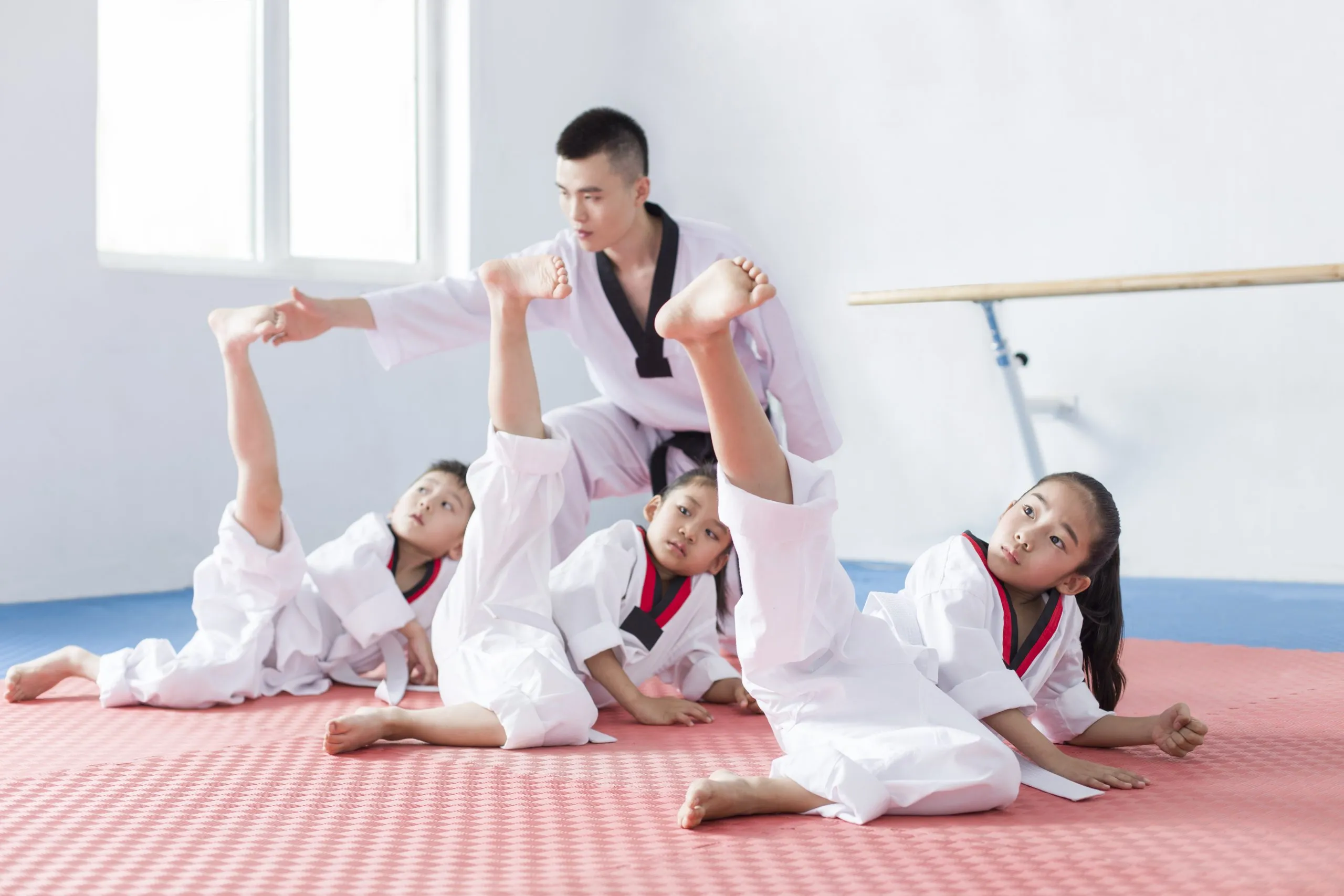 young instructor teaching children tae kwon do 2024 10 16 12 09 36 utc scaled